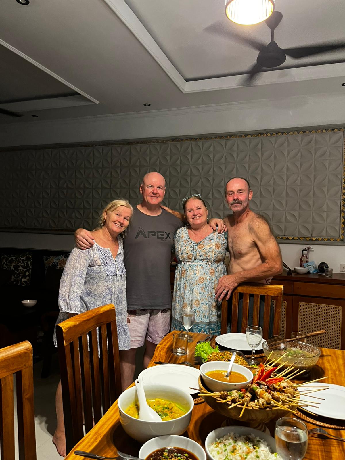 Guests enjoying a private Indonesian dinner at their Bali villa