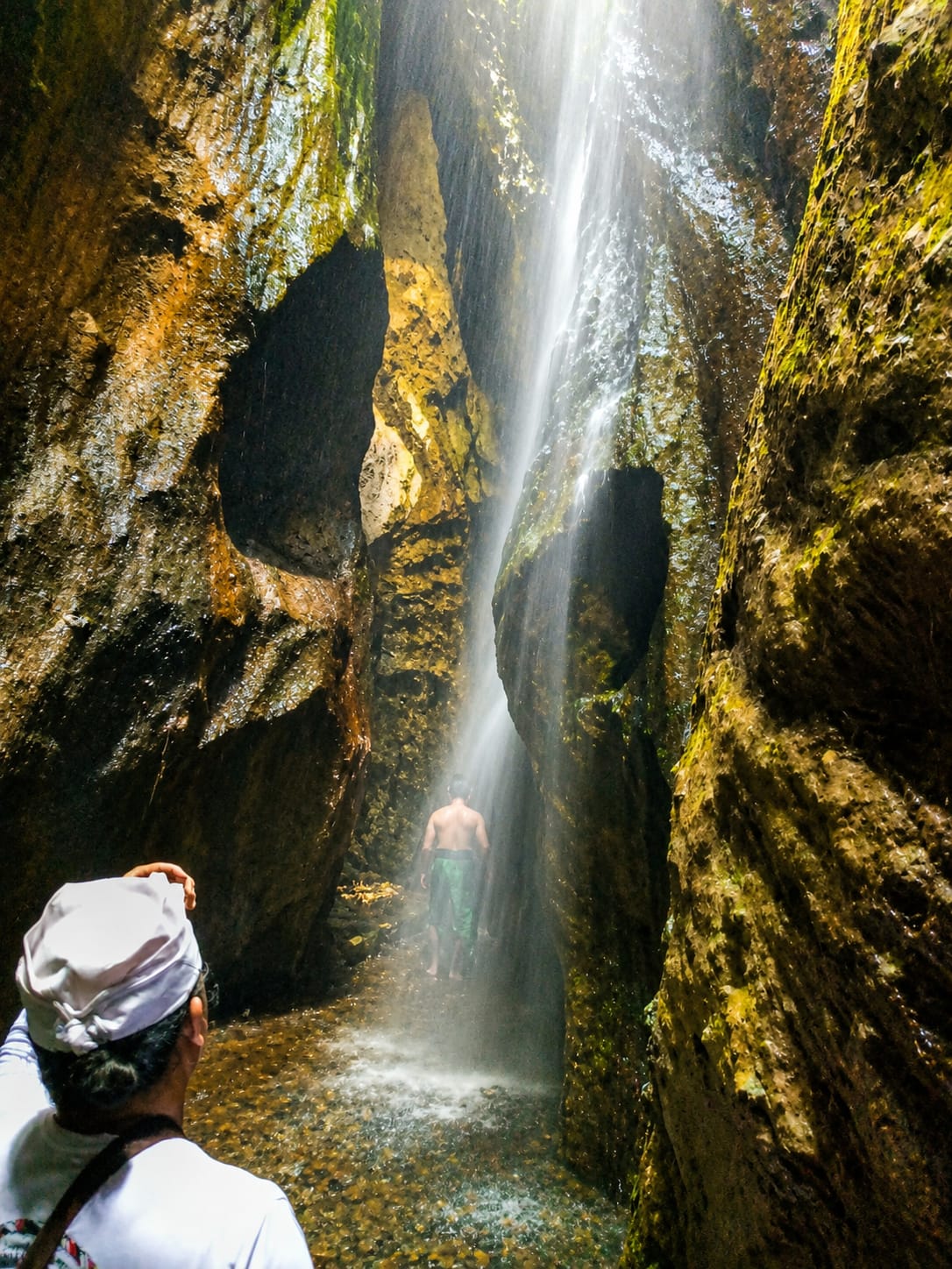 Guests discovering a hidden waterfall during a private Bali tour