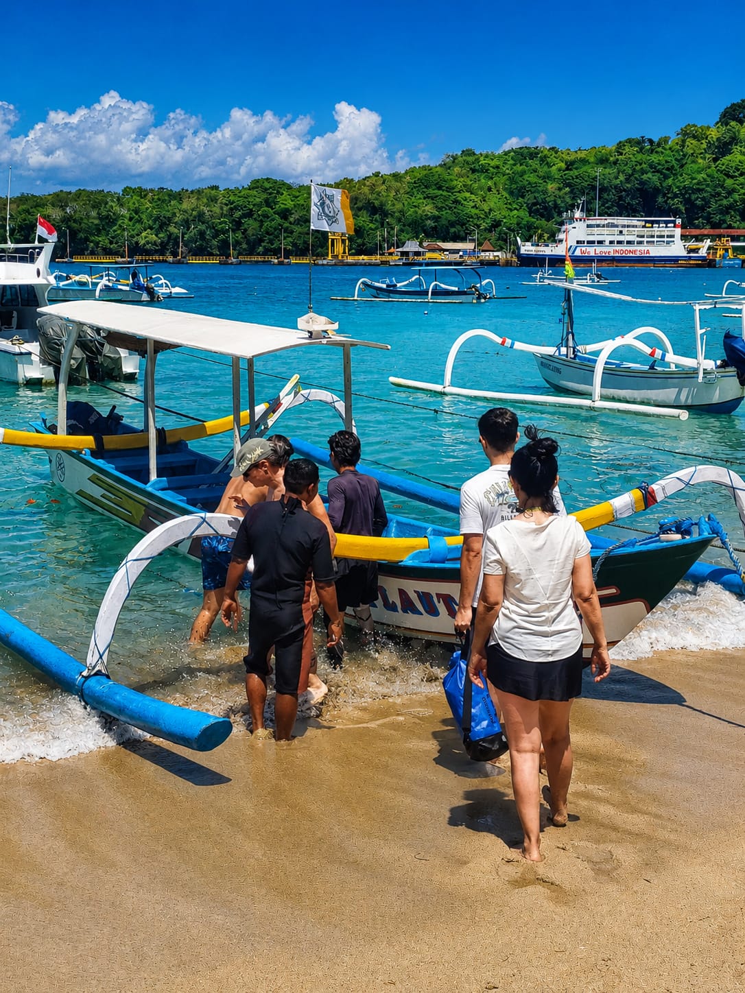 Guests boarding a traditional boat for an island experience