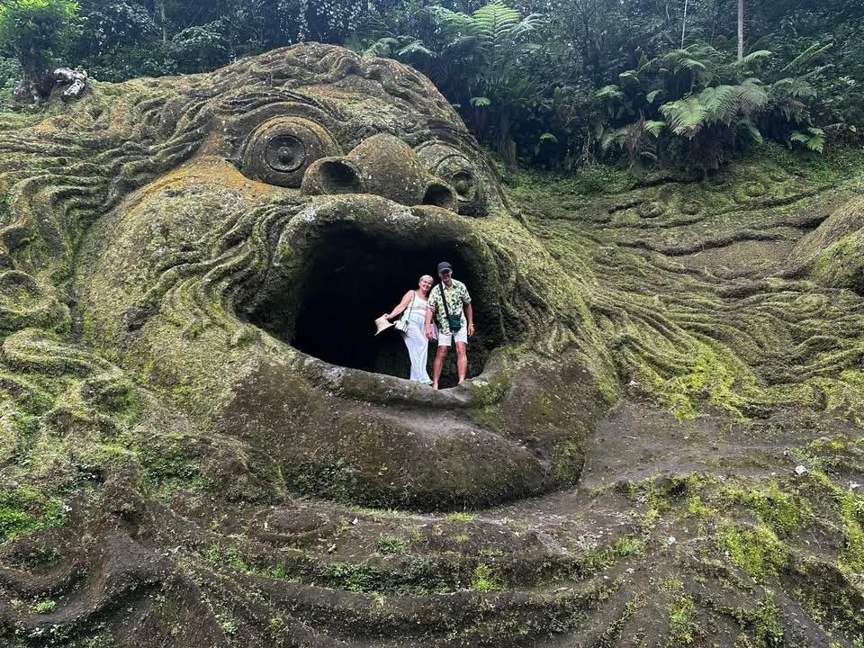 Ubud forest carving stop surrounded by lush jungle